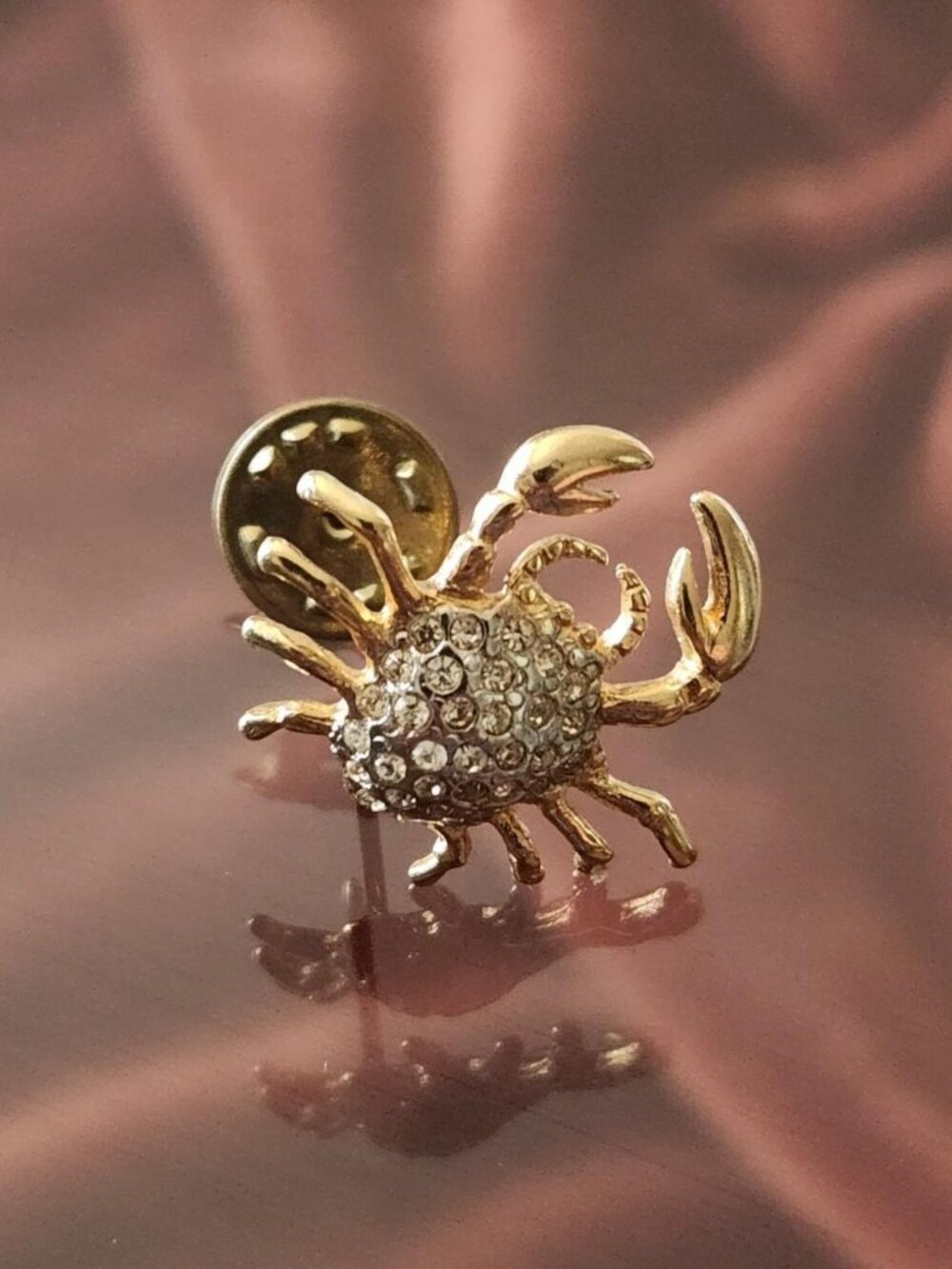 Vintage Gold-tone crab lapel pin with rhinestones.